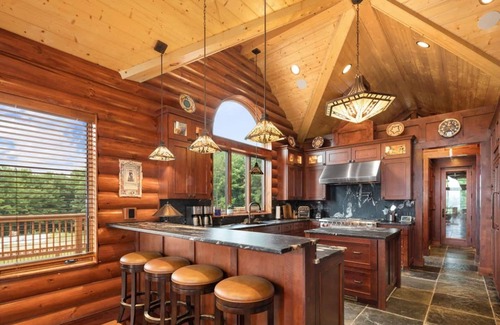 Kewadin Haus | Secluded Luxury Lodge Overlooking Torch Lake with Hot Tub, Elevator on Hilltop!