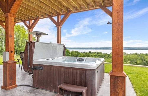 Kewadin Haus | Secluded Luxury Lodge Overlooking Torch Lake with Hot Tub, Elevator on Hilltop!