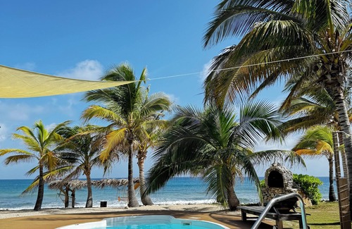 West End Haus | Secluded Sunsets 3400 Sq Ft Villa with 3 Separate Suites on the Ocean with Pool!