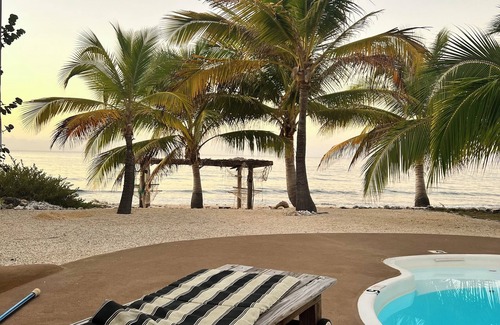 West End Haus | Secluded Sunsets 3400 Sq Ft Villa with 3 Separate Suites on the Ocean with Pool!