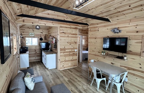 Frederic Hütte | Serene cottage on private lake! Enjoy a private dock, fire pit, canoe, & more!