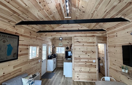 Frederic Hütte | Serene cottage on private lake! Enjoy a private dock, fire pit, canoe, & more!