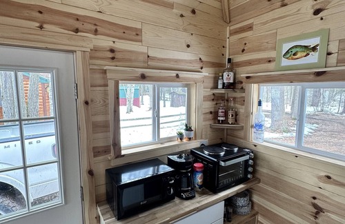 Frederic Hütte | Serene cottage on private lake! Enjoy a private dock, fire pit, canoe, & more!