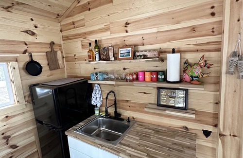 Frederic Hütte | Serene cottage on private lake! Enjoy a private dock, fire pit, canoe, & more!