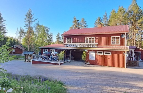 Skalsjo Hotel | Skålsjögården Timber Lodge