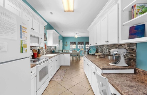 Surfside Beach Haus | Soak in the salty breeze on the awesome deck with a great ocean view! Site 920