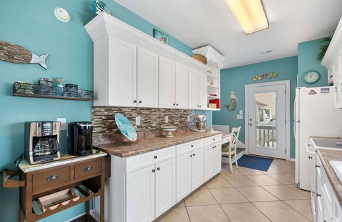 Surfside Beach Haus | Soak in the salty breeze on the awesome deck with a great ocean view! Site 920