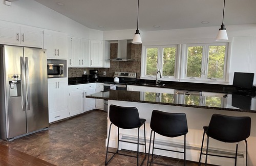 Rindge Haus | Spectacular lake house with private dock, beach area & gorgeous views