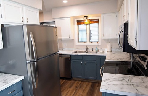 Cody Haus | Stampede Place- New listing! Dog friendly home close to grocery stores and library