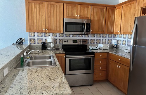 Colliers Bay Resort | Step onto beach! Beach front 2 bed + bath condo with full kitchen, LR/DR, patio