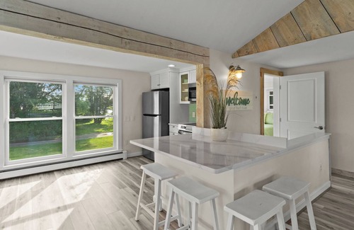 Kenyon Hütte | Stunning waterfront home with big yard & dock! Voted #1 rental in all of RI!