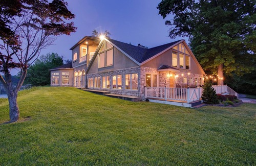 Earlville Villa | Stunning waterfront villa with indoor pool and kids swing set and play area.