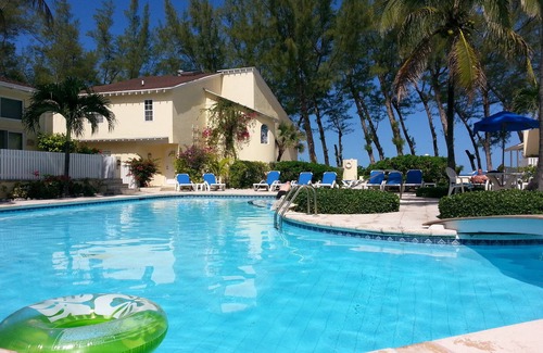 Paradise Island Eigentumswohnung | Sunrise Beach Club # 1, Pool, BBQ Grill, Liegestühle. Direkt am Strand!
