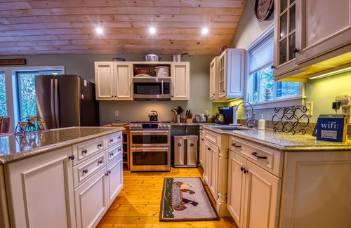 Rangeley Haus | The 4 Seasons on Mooselookmeguntic Lake with dock, mooring, 4 kayaks, fire pit, and pet friendly!