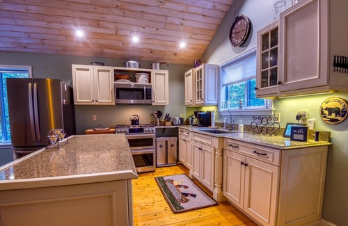 Rangeley Haus | The 4 Seasons on Mooselookmeguntic Lake with dock, mooring, 4 kayaks, fire pit, and pet friendly!