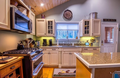 Rangeley Haus | The 4 Seasons on Mooselookmeguntic Lake with dock, mooring, 4 kayaks, fire pit, and pet friendly!