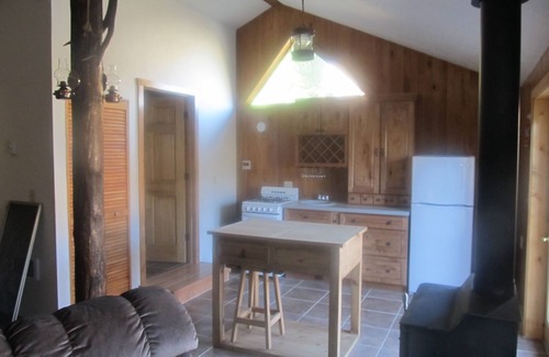 Wapiti Kabine | Die Remington - Yellowstone und Cody Cabin mit spektakulärer Aussicht.