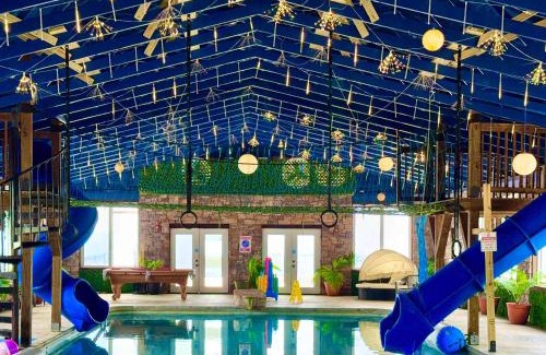 Bryant Haus | This is IT Cabin with a hot tub fire pit & indoor pool