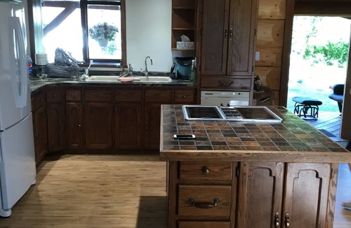 Swift Current Haus | Three level Log Home on Private 40 Acre Estate.