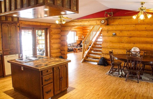 Swift Current Haus | Three level Log Home on Private 40 Acre Estate.