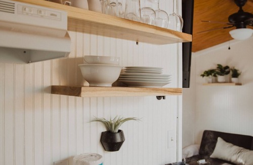 Meeker Haus | Tiny Home with one Queen bed and a Futon couch. Sleeps: 3