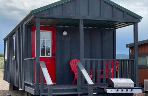 Meeker Haus | Tiny Home with one Queen bed and a Futon couch. Sleeps: 3