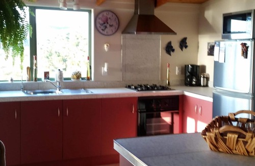 Haruru Haus | Baumkronen - Spektakuläre Aussicht auf Fluss und Meer