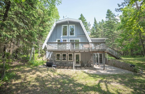Bigfork Kabine | Unique modified A-frame cabin with loft, sandy lakefront, and amenities of home.