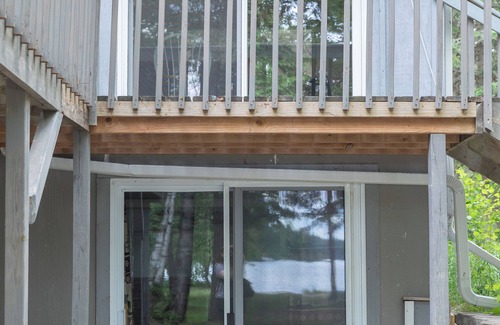 Bigfork Kabine | Unique modified A-frame cabin with loft, sandy lakefront, and amenities of home.