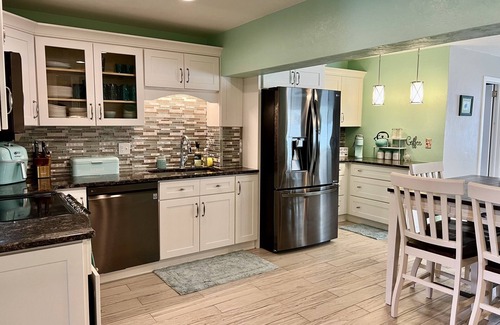 Sunny Shores Haus | Walk to the beach! Spacious home with comfy beds, game room, & fenced yard.