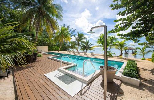 Breakers Haus | White Cottage by Grand Cayman Villas & Condos