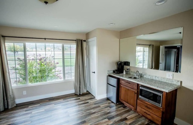 1 bedroom with a king-size bed, one bathroom, and kitchenette.