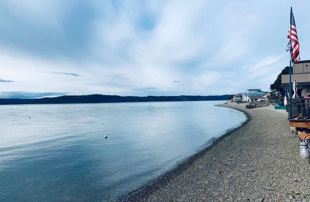 100-year-old cabin Perched on stilts above the Puget Sound.