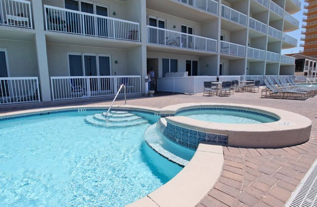 SUMMER IS HERE! Enjoy this first-floor unit with walk out access to the pool!