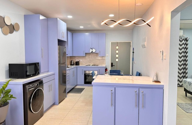 2-bedroom apt in St George's with AC, WiFi, parking, near city, beach, stadium