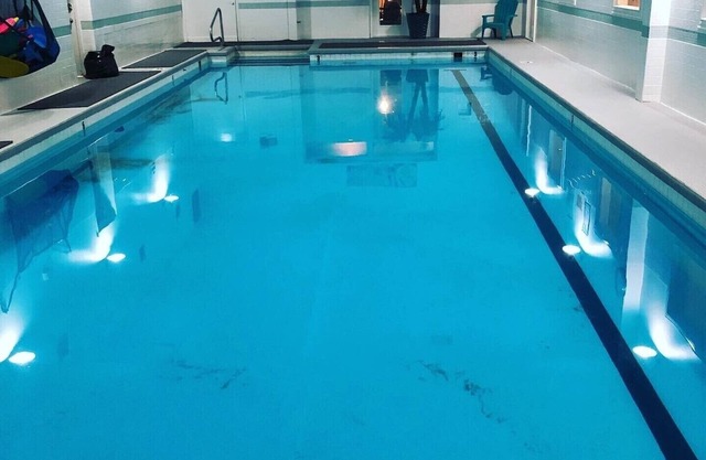 Downtown Condo above Gym with Pool Hot tubs sauna etc.