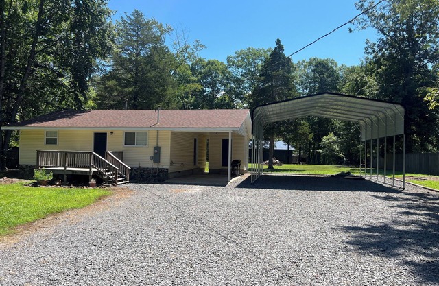 2-bedroom house in Higden with 24x30 covered parking for boats and lake toys!!