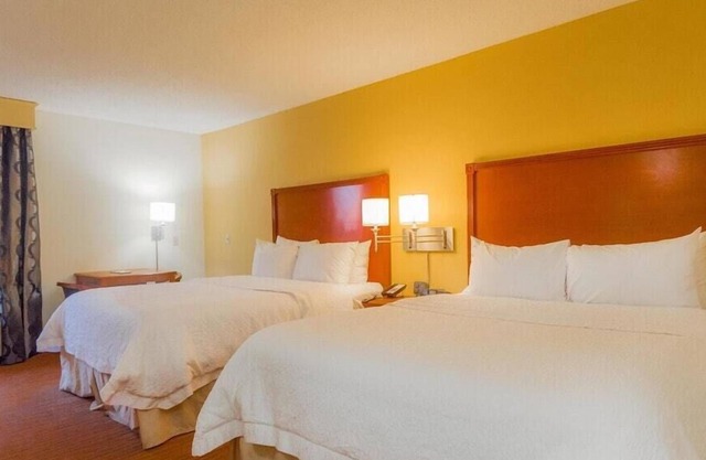 2 Connecting Suites with Three Beds at a Full Service Hotel by Suiteness
