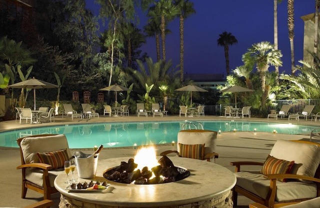 2 Connecting Suites with Three Beds and One Sofabed at a Full Service Hotel by Suiteness