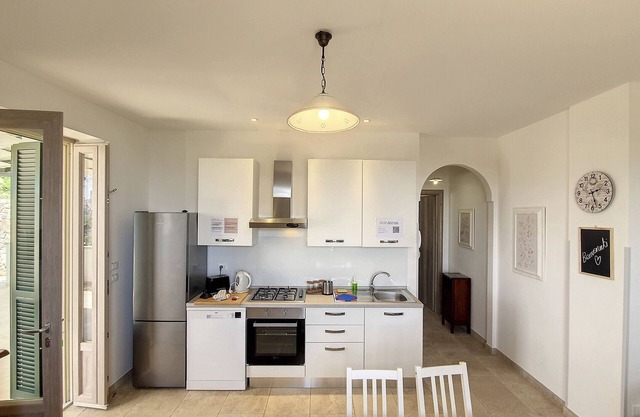 250m from beach: 2-apt house w/sea view&garden