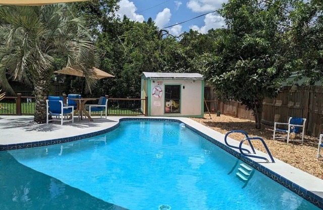 3 bed / 2 bath house with tropical backyard, pool, fenced yard, hammock