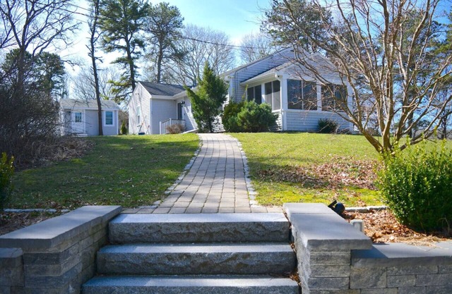 3 bedroom 2 bath Renovated Ranch with Pond Views on peaceful private 1.5 acre lot in North Falmouth