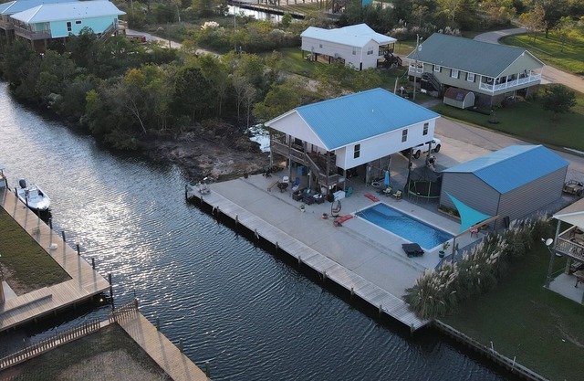 3 bedroom house, full size swimming pool and 100' of docked waterfront access.