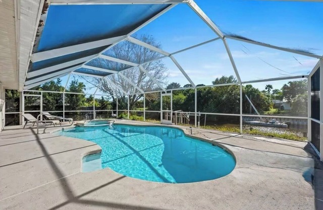 3-bedroom pool house by the ocean access canal with WiFi, AC, fitness room