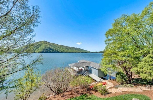 3 Bedrooms, 2 Flex Rooms, 4½ Bathrooms! Beautiful lakefront home with wide water and mountain view