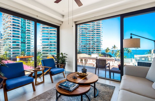5th-floor condo with partial ocean views, heated pool, sauna, gym, balcony, W/D