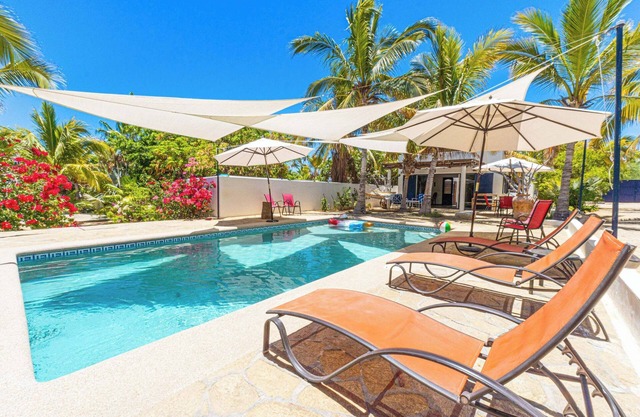 A Beautiful private Beach House w/ Large Pool, surrounded By Palms & Flowers