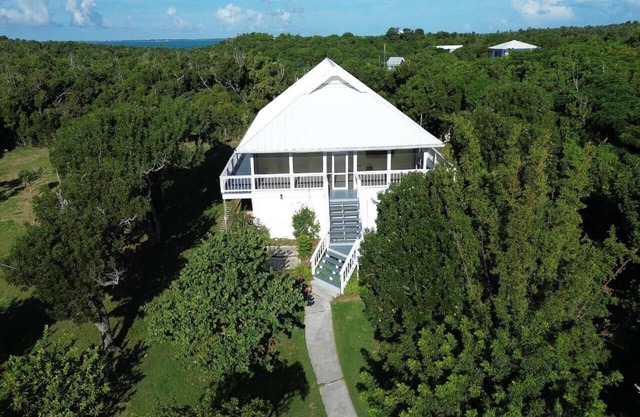 A boater's dream home with a private dock UP THE CREEK from Hope Town Harbor.