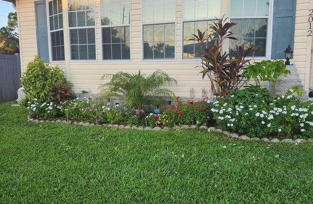 A bright Floridian-style home with luxury amenities and multiple beach accesses.