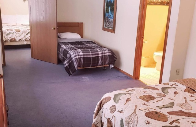 A fun fishing themed private guestroom for up to 5 inside the Lodge at North Ironwood Acres resort. TWO bathrooms! DOG FRIENDLY!!.